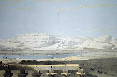 Distant mountains across the Nile contrast with ancient stonework.